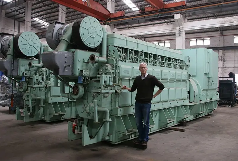 EMAC's UK Sales Representative-Richard Smith with marine main engine 800x540